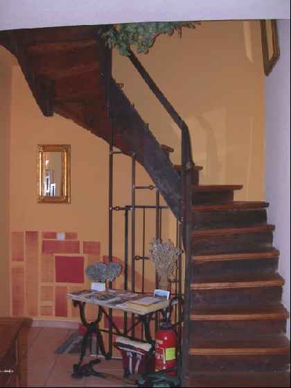 Staircase in wood & terracotta tiles